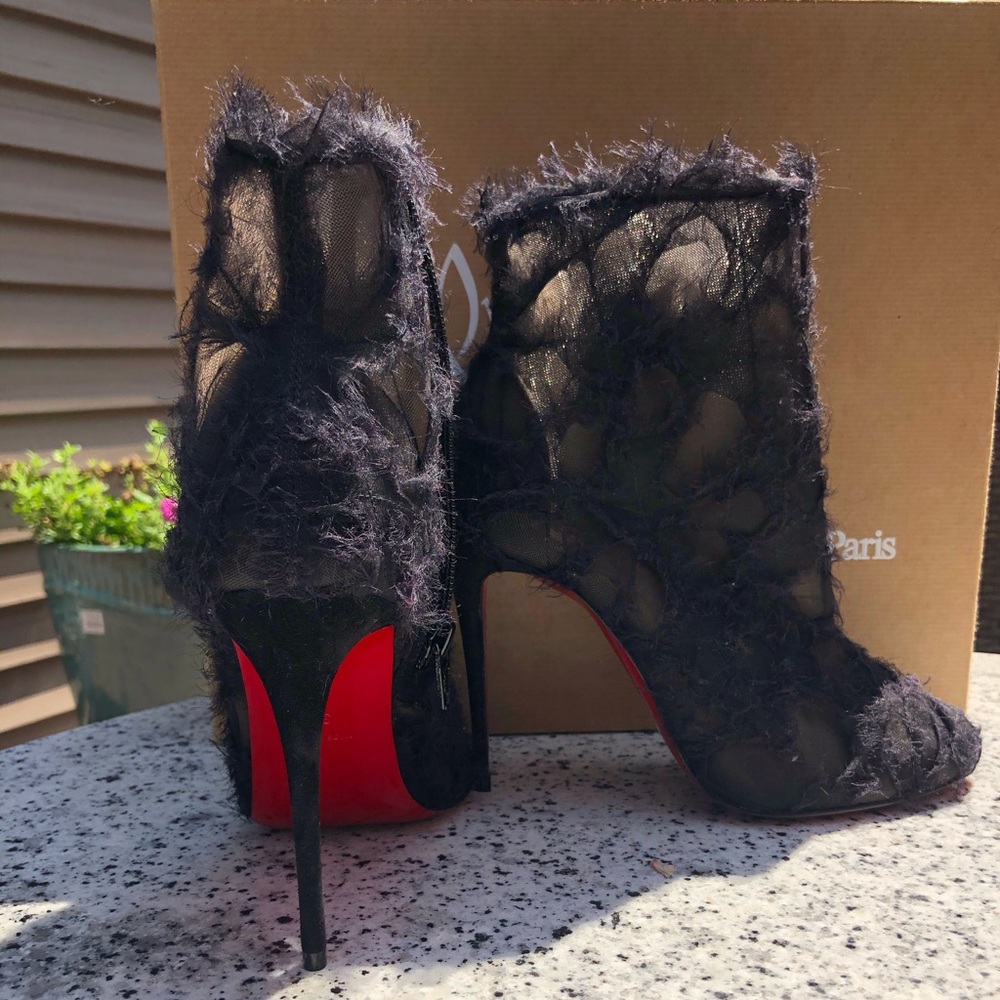 Unworn Christian Louboutin booties size 37 black.